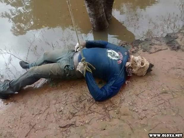 Estuprador e amarrado de cabeca para baixo em rio cheio de piranhas 4